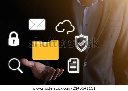 Document Management System DMS .Businessman hold folder and document icon.Software for archiving, searching and managing corporate files and information.Internet Technology Concept. Digital security.