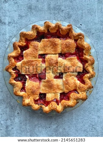A picture of fresh raspberry pie.