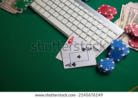 Poker online, casino, online gaming business. Chips, cards money and pc. Background for online gaming business.