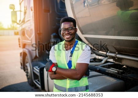 Portrait of handsome young African American man working in towing service on the road. Roadside assistance concept. Royalty-Free Stock Photo #2145688353