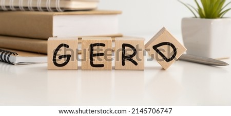 Word GERD Gastroesophageal reflux disease on wooden cubes on the table in isolation. Royalty-Free Stock Photo #2145706747