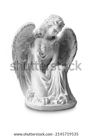 
Guardian angel, sculpture of a praying angel, plaster statue, plaster wings on a white background, decor, symbol of strength, truth and faith in God, Christian church, prayer, religion concept