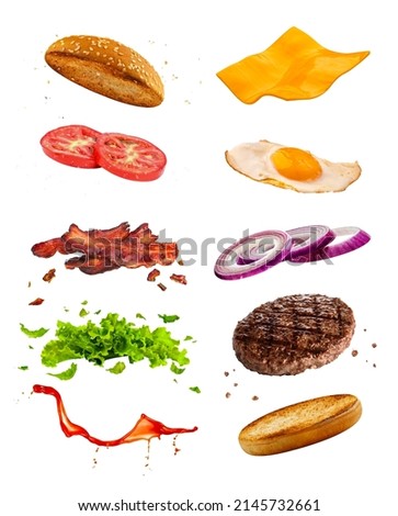 delicious burger with floating ingredients separated on white isolated background. cafe and restaurant advertisement Royalty-Free Stock Photo #2145732661
