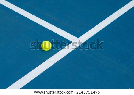 A Single Tennis Ball On a Tennis Court - Great Photo For Tennis or Sports Related Promotions Royalty-Free Stock Photo #2145751495