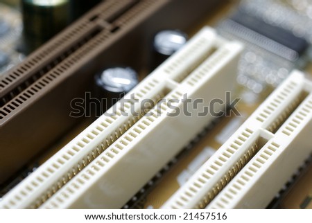 Mainboard close up framed photography. Selective focus on PCI slot.