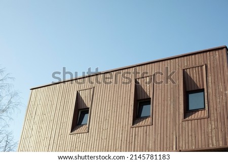 Roof of house. Roof on country house. Windows in wall. Country dwelling. Royalty-Free Stock Photo #2145781183