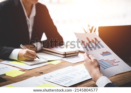 Teamwork with price chart analyzes business people on the table at the conference room. Royalty-Free Stock Photo #2145804577