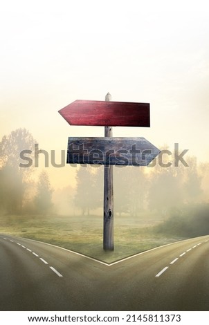 wooden signposts for two different roads