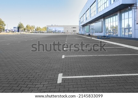 Empty parking lot near supermarket