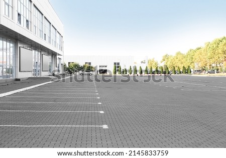 Empty parking lot near supermarket Royalty-Free Stock Photo #2145833759