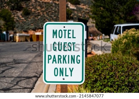 Motel guest only parking sign Royalty-Free Stock Photo #2145847077