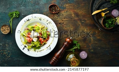 Vegetable salad with feta cheese. Vegan menu. Top view. Rustic style.