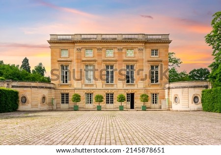 Petit Trianon in Versailles park outside Paris at sunset, France Royalty-Free Stock Photo #2145878651