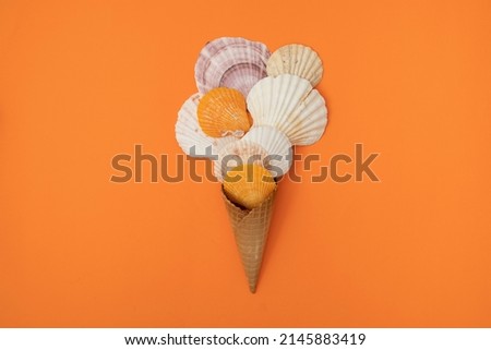 Abstract ice cream made out of sea shells. Summer sunset colours as a background