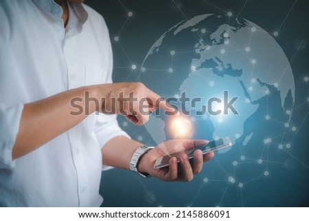 Business man using smartphone in technology concept.