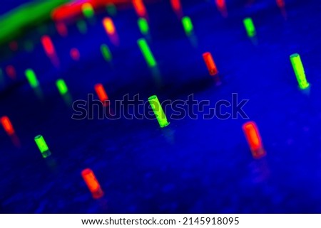 bright neon colored glowing diodes on a blue background