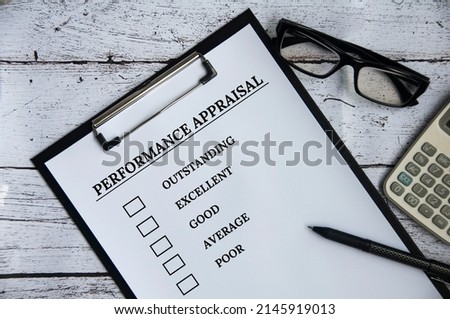 Top view of performance Appraisal checklist on clip board with white background. Performance review concept