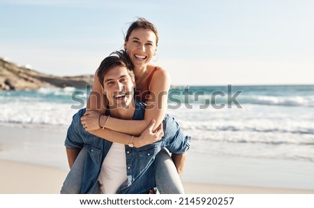 The beach puts everyone in a better mood. Shot of a middle aged couple spending the day at the beach.