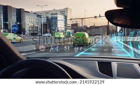 Futuristic Autonomous Self-Driving Car Moving Through City, Head-up Display HUD Showing Infographics: Speed, Distance, Navigation. Road Scanning. Driver Seat Point of View POV  First Person View 