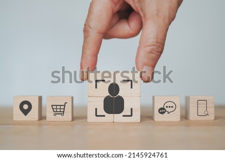 senior businessman's hand complete  crop icon, people inside  on wood cube   for Buyer persona and target customer concept. Buyer or customer psychology profile or characteristics