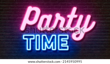 Neon sign on a brick wall - Party time