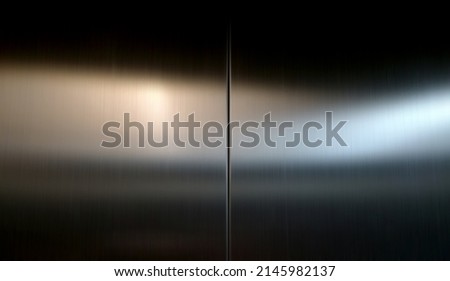 Reflection of light on a shiny metal texture,stainless steel background. Royalty-Free Stock Photo #2145982137