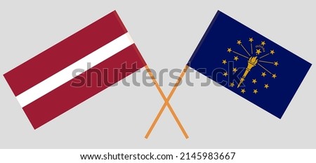 Crossed flags of Latvia and the State of Indiana. Official colors. Correct proportion. Vector illustration
