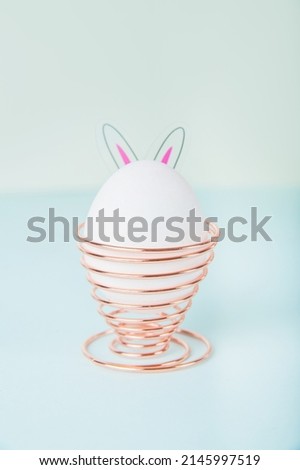 Easter eggs with bunny ears as concept for festive spring card..