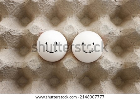 Eggs with funny faces drawn