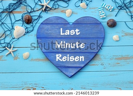Heart on a nautical background with the text Last Minute Reisen,Last Minute Reisen means last minute travel. Royalty-Free Stock Photo #2146013239