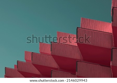 Abstract architecture background. balcony construction facade detail made of cement blocks. Hot contrast colors between pink walls and green sky. Modern, cool, minimalist rosy geometric shapes Royalty-Free Stock Photo #2146029943