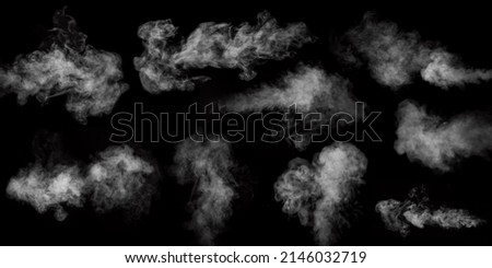 A set of nine different types of swirling, writhing smoke, steam isolated on a black background for overlaying on your photos. Horizontal and vertical steam. Abstract smoky background Royalty-Free Stock Photo #2146032719