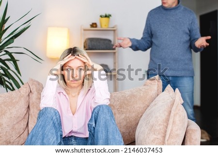 Angry middle aged couple arguing shouting blaming each other of problem, frustrated husband and annoyed wife quarreling about bad marriage relationships, unhappy family fighting at home concept