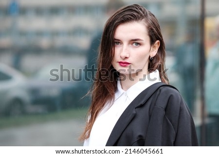 Portrait of a successful woman. Young businesswoman girl. People in the city