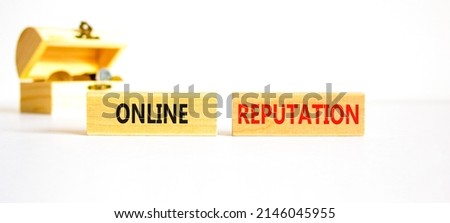 Online reputation symbol. Wooden blocks with concept words Online reputation on beautiful white background. Wooden chest with coins. Business online reputation concept. Copy space. Royalty-Free Stock Photo #2146045955