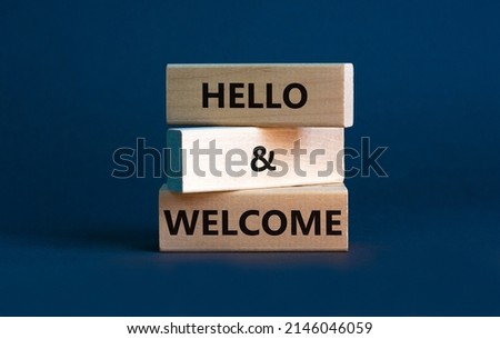 Hello and welcome symbol. Concept words Hello and welcome on wooden blocks. Beautiful grey background. Business hello and welcome concept. Copy space. Royalty-Free Stock Photo #2146046059