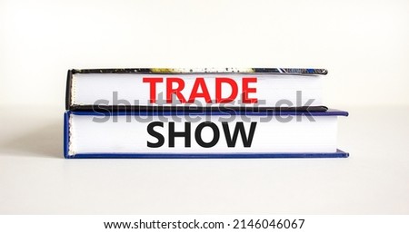 Trade show symbol. Books with concept words Trade show on beautiful white background. Business economic financial trade show concept. Copy space.