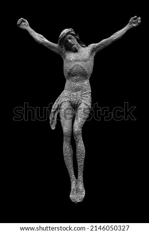 Ancient iron statue Jesus Christ isolated on black background.