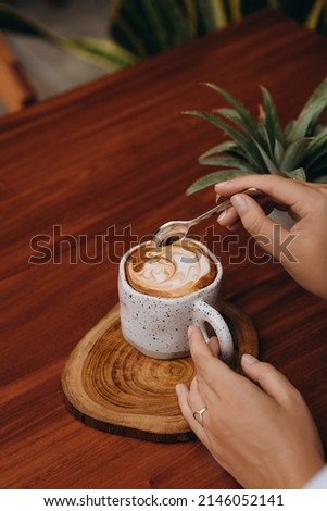 Girl drinking coffee in a cafe