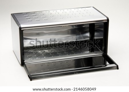 Metal bread box open, isolated