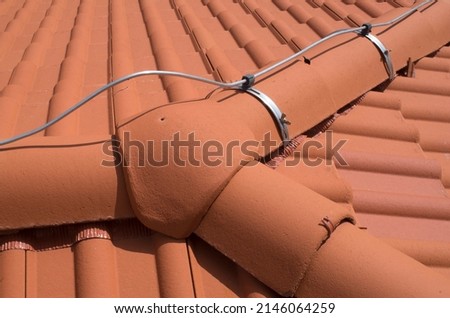 New dry ridge system and 3 ways ridge tile of the roof top  close up
 Royalty-Free Stock Photo #2146064259