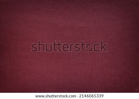 Texture of matte leather maroon color, vignette. Royalty-Free Stock Photo #2146065339