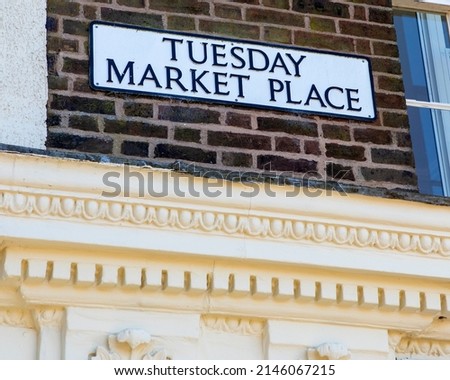 Street sign for Tuesday Market Place in the town of Kings Lynn in Norfolk, UK.