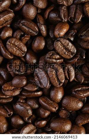 Top view of the texture of roasted ready-to-drink coffee. Scene of coffee beans. Black ground coffee