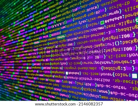 Lines of code of a software with several colors. Abstract program code on computer screen. Web site codes on computer monitor. Letters, chars, and digits