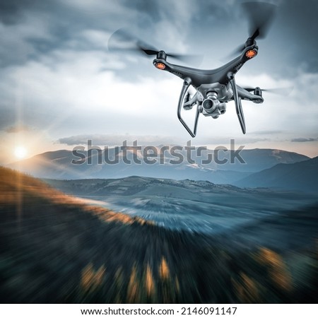 Modern drone in the sky. The drone is flying in the sky.