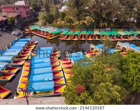 Aerial Drone Shot of Colorful Boats in Xochimilco. Tours by cannels with floating gardens in Mexico City CDMX, Mexico