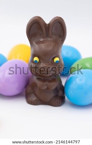 Chocolate bunny with plastic easter eggs