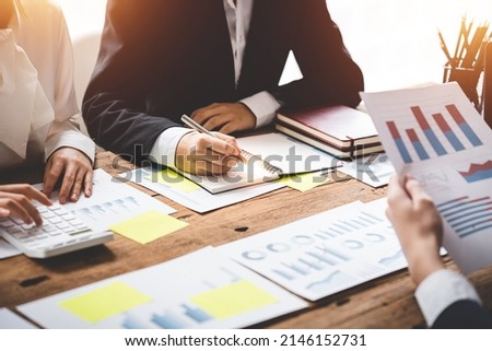 Teamwork with price chart analyzes business people on the table at the conference room.