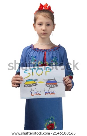 A little sad Ukrainian girl holds a drawing in her hands with the inscription "Stop the war". Studio photo on a white background.